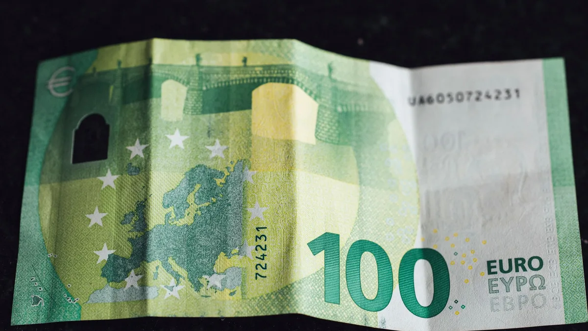 Close-up of a folded 100-euro banknote showing the map of Europe and EU stars — file stock photo from 2020, no people